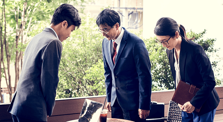 Japanese business people greeting by bowing