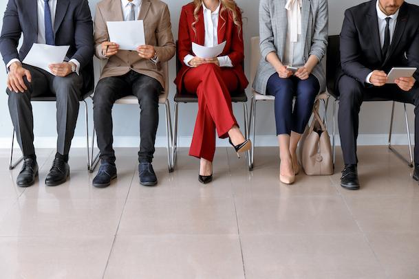 how to become a teacher in the US - group of professionials in an office waiting for their teacher interview