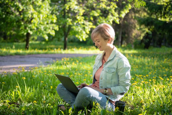 woman teaching English on laptop outside: how to make teaching english interesting.