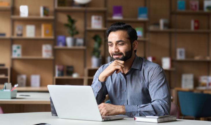 man sitting in front of laptop