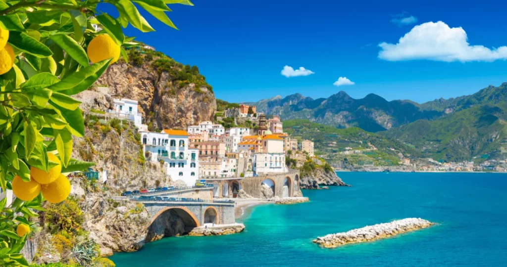 Beautiful view of Amalfi on the Mediterranean coast with lemons in the foreground, Italy